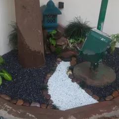 Another view of a custom stone garden I created. The design incorporates a miniature pagoda and a dry riverbed path, turning an unused corner into a point of interest.
