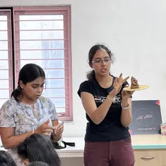 Here I am demonstrating a sculpting technique during a clay Ganesha workshop. I provide step-by-step instructions to ensure everyone, from kids to adults, can create their own beautiful idol.