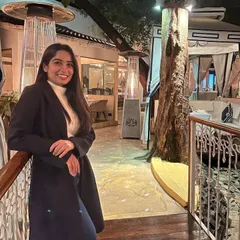A happy guest, featured by Curly Tales, enjoying the ambiance of Sevilla. We love seeing our guests make our space their own.