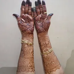 This is the kind of rich, dark stain you can expect from my henna. This full-arm bridal design has developed into a beautiful deep brown color.