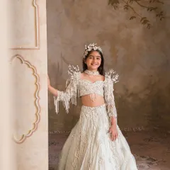 The complete royal look, this lehenga set is paired with a matching embellished headband for a perfectly coordinated ensemble.