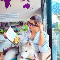 A moment of peace for both pet and parent. Here, you can unwind and browse our menu while your furry companion relaxes comfortably by your side, enjoying the calm and friendly atmosphere.