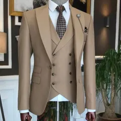 A sophisticated beige three-piece suit. This neutral color is versatile and elegant, perfect for both business and formal occasions. The double-breasted waistcoat and lapel chain add stylish details.