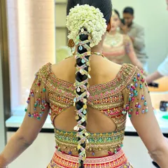 For a festive Teej celebration, I created this traditional braid adorned with colorful gota patti and seashells, topped with a fragrant gajra of fresh jasmine. This style is vibrant, playful, and deeply rooted in Indian tradition.