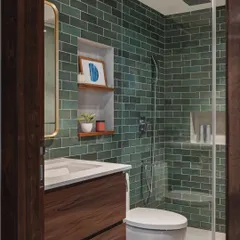 A third variation on the same bathroom layout, this time with a deep green subway tile. This color creates a rich, earthy, and calming atmosphere, turning the shower area into a beautiful feature.