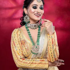 This half-saree look is beautifully complemented by our silver-finish jewellery set with green beads. It's a modern and fresh take on traditional wear.