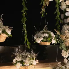 A closer look at the elegant floral decor for the engagement. I use hanging baskets and fresh white flowers to create a dreamy, sophisticated ambiance for your special day.