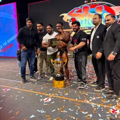 On stage with my student Bharat after his overall championship win. This is the ultimate goal of our coaching.