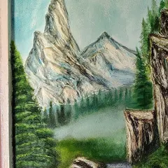 A close up of the sculpted mountain peaks from the same landscape mural. I used a palette knife and different tools to create the sharp, rocky texture of the mountains against the soft, misty background.
