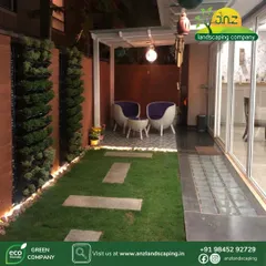 Another night view, emphasizing the cozy and intimate feel of this small garden space after dark.