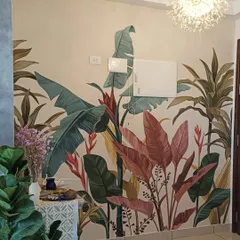A colorful tropical plant mural that brings life to a foyer. The bright pinks and greens create a welcoming and cheerful entrance.