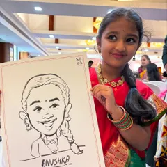 The pure delight on a child's face is priceless. Here's a young guest proudly showing off her black and white ink caricature, a fun party favor she can cherish.