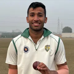 Bhavya Kakkar holds the ball after his brilliant 5-wicket haul, which included a hat-trick, in a dominant DDCA League match victory for Delhi Blues.