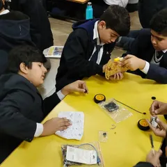 Students from Lions Public School enthusiastically participate in a workshop. This image captures their curiosity and passion as they work together to assemble and program their first robotic projects.