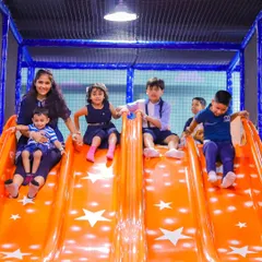 Whooshing down our giant multi-lane slide. It's wide enough for friends to slide down together and is a favorite for kids of all ages, providing endless excitement and laughter.