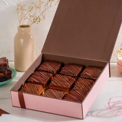 A gift box filled with our irresistible Millionaire Shortbread. The rich chocolate, melt-in-your-mouth caramel, and crunchy shortbread make this one of our most popular gifting items.