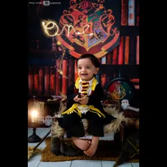 Celebrating a magical first birthday. I can even add special effects, like this glowing "one" created by a wand, to make your Harry Potter themed photos even more special.