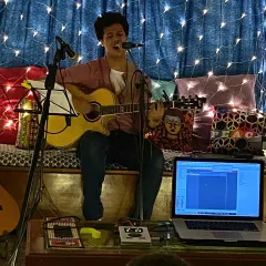 A shot from an intimate house gig at The Hertz Cave. The cozy setup with fairy lights is perfect for sharing personal stories through my original songs.