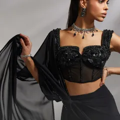 The intricate black-on-black sequin and beadwork on the Hertha Saree Set's corset blouse.