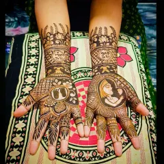 The complete view of this special baby shower mehandi, showcasing the combination of portrait work, symbolic motifs, and traditional patterns.