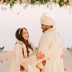 A beautiful shot of a bride at her Goa day wedding. The fresh, glowing makeup with soft glam details was perfect for the beachside ceremony and her ivory lehenga.