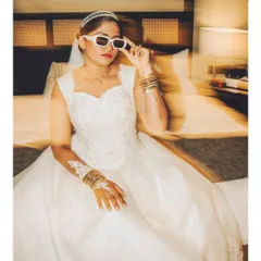 A fun and edgy bridal portrait using motion blur. The bride's cool sunglasses and pose show off her personality, adding a unique twist to the wedding gallery.