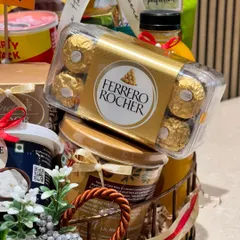 A close-up look at the gourmet selections I include in my corporate hampers. This particular curation for Qatar Airways features premium Ferrero Rocher chocolates, showcasing the high-quality brands I partner with to create impressive business gifts.
