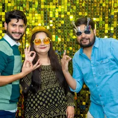 Adults love the props just as much as the children. These guests are striking a pose with their fun glasses, enjoying the photo booth moment.