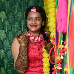 A candid shot of a happy bride, her intricate mehendi on full display. This is a celebration of love, tradition, and personal beauty.