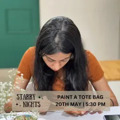 Lost in the creative process. My paint-a-tote-bag kits are a fantastic way to unwind and make something that's both beautiful and practical. I provide pre-printed designs or a blank canvas for you to let your imagination run wild.