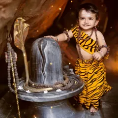 Our little Shiv bhakt, standing by a Shivling in a cave-like setup. We create detailed, immersive sets for our Mahadev-themed shoots.