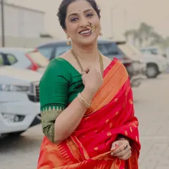 A candid, smiling shot of Madhurani, showing how the makeup looks natural and fresh even outdoors.