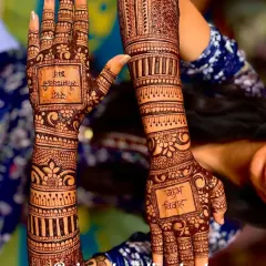 A unique design that includes auspicious phrases like "Shubh Vivah" written in Hindi, along with the couple's names.