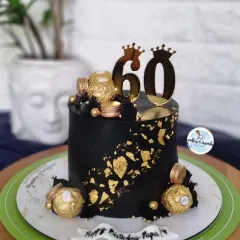 Celebrating a 60th birthday calls for something bold and elegant. This black and gold eggless cake, decorated with Ferrero Rocher chocolates and a custom topper, is a perfect example of a sophisticated design for a major milestone.