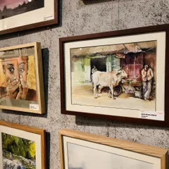 My watercolor painting, 'Along the street', framed and exhibited at the 'Vietnam in Acquarello' exhibition in Hanoi. It was an honor to be featured among artists from around the world.