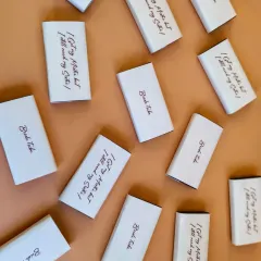 Even the smallest details matter. These custom chocolate bars were included in the bridesmaid hampers, with sweet messages like "I Got My Mister but I still need my Sister!"
