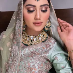 Our beautiful, subtle bride for her Nikkah day. This look features soft, earthy tones on the eyes and a nude lip, letting her natural beauty shine through in her elegant mint green outfit.