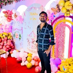 A look at one of our grandest setups, a carousel-themed first birthday party. The vibrant pink and yellow balloon decor fills the space, creating a magical atmosphere for the celebration.