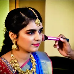 A behind-the-scenes moment during an engagement makeup session. Here, I am applying blush to add a healthy flush of color, one of the final touches to create a radiant and picture-perfect look.
