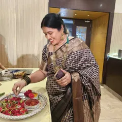 A candid moment of our client in the bold black checkered saree, showing its versatility for both formal and informal gatherings.