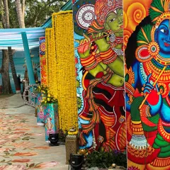 We used vibrant, hand-painted panels depicting Krishna and other traditional motifs to line the walkway for this Vrindavan-themed event.
