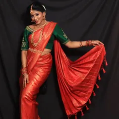 This client wanted a powerful and striking look for her photoshoot. The vibrant red saree with its perfectly fanned pleats helped create just that.