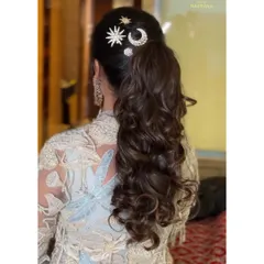 Another angle of the celestial-themed ponytail, highlighting the beautiful curls and accessories.