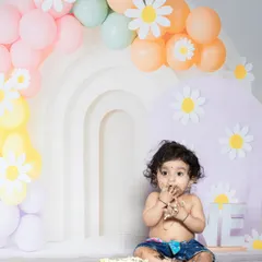This little girl is getting right into her first birthday cake. These are the fun, candid moments I love to capture.