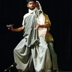 A moment of dramatic expression on stage. My experience as an actor taught me how to tell stories with my body, a skill that I now use to communicate the essence of each asana.