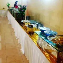 A clean and tidy buffet setup in a simple hall, showing how I can work within different venue constraints to provide a professional service.