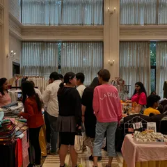 Another view of the bustling crowd at our indoor exhibition. We ensure a comfortable and spacious layout for both vendors and shoppers, with stalls offering a variety of products from clothing to accessories.