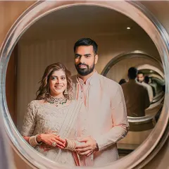 A modern-day portrait. This infinity mirror shot is a creative and stunning way to capture the couple's reflection and their endless love.