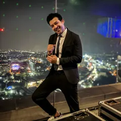 Suited up and ready for a rooftop DJ gig. My work as a DJ often complements my modeling, especially for events and lifestyle brands.