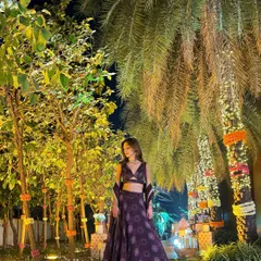 Another look at this gorgeous lehenga, this time set against a backdrop of beautifully lit palm trees.